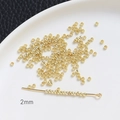 Detailed close-up showing 2mm gold-plated spacer beads for DIY jewelry making - 2mm / 14K Gold