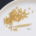 Vue macro détaillée de perles à écraser dorées 3mm pour création de bijoux DIY et colliers - 3mm / Or 18 carats