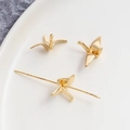 Macro detail of 14K gold plated origami crane pendants with center hole for DIY jewelry - 18K Gold