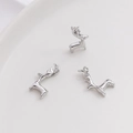 Macro detail of three silver deer pendants for DIY jewelry making on white background - Reindeer Pendant / White Gold