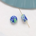 Detailed macro view of hand-painted blue and green floral ceramic beads for DIY jewelry - Blue Green Sand Style (5#)