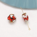 Detail of hand-painted ceramic beads with abstract red and black floral patterns for DIY - Bat Mask Style (13#)