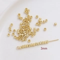 Vista macro de cuentas espaciadoras de 3mm bañadas en oro con grano vertical para joyas DIY - Patrón Espiral (1#) / 3mm (50 Unidades/Paquete) / Oro de 14K