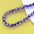 Close-up of blue glass beads with white flower patterns for DIY jewelry making - 5# Dark Blue