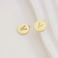 Macro detail of 18k gold plated letter V charm with cubic zirconia pavé and hollow back - Letter V / Gold