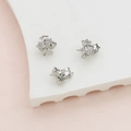 Detailed macro view of silver star charms with zircons for DIY baroque hair jewelry accessories - White Gold