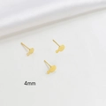 Detailed macro view of 4mm gold-plated flat base ear studs with hanging loop - 4mm / 18K Gold