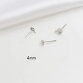 Detail view of 4mm silver-plated earring studs with loops for DIY jewelry making - 4mm / White Gold