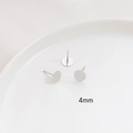 Macro shot of 4mm silver plated stud earring bases with S925 needles for DIY jewelry - 4mm / White Gold