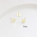 Macro detail of 5mm gold plated flat stud earring bases for DIY jewelry making - 5mm / 14K Gold