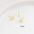 Close-up of S925 sterling silver ear studs with 5mm gold-plated round flat disc base - 5mm / 18K Gold
