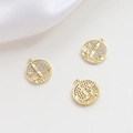 Macro shot of gold-plated castle pendants with micro-pave cubic zirconia inlay detail - 14K Gold