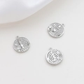 Detailed close-up of castle pendants with micro-pave zircons and silver plating - White Gold
