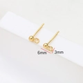 Macro detail of 3mm gold-plated ball stud earring with loop for DIY jewelry making - Gold #1