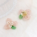 Detail of handmade pink crystal flower bead charm with gold metal base and green leaves - Pink