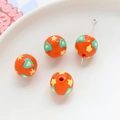Close-up of orange acrylic round beads with heart and star patterns for DIY jewelry creation. - Orange Green Heart Yellow Star (3#)