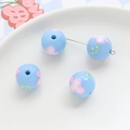 Macro shot of light blue acrylic flower and smiley face beads for DIY jewelry making - Light Blue Floral Smiley (7#)