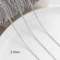 Macro detail of 2.0mm wide silver-plated cross chain spool for DIY jewelry making - White Gold Plated 2.0mm O-Chain