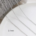 Macro detail of 2.1mm silver cross chain link for DIY handmade jewelry crafting - White Gold Plated 2.1mm O-Chain