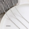 Detail of 2.6mm silver chain link showing polished metallic texture and dense structure - White Gold Plated 2.6mm O-Chain