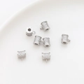 Macro view of micro-pave zircon charms in bright silver for DIY jewelry making - White Gold