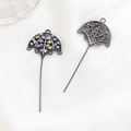 Detailed macro view of zircon-studded crown umbrella pendant with metallic plating - Umbrella Pendant Style / Gunmetal