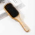 Detail of bamboo air cushion hairbrush with black boar bristles and pearl pattern inlay - Large / White Boar Bristle