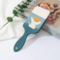 Detail of blue hair brush with back view illustration on artistic books and fabric - Figure Back View Pattern (A)