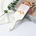 Detail of white hairbrush with fashion illustration on cushioned back for scalp massage - Fashion Women Pattern (B)