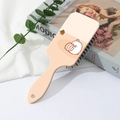 Detail of cute rabbit print on a portable air cushion massage hair brush handle - Cartoon Rabbit Style (A)