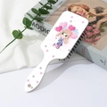 Detail of white air cushion hairbrush featuring cute cartoon girl and cat illustration - Cycling Girl Pattern (B)