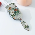 Detail of detangling hairbrush featuring a vintage floral pattern and ergonomic air cushion - Dark Green Vintage Floral Style (A)