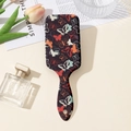 Detail of vintage butterfly print hairbrush with air cushion massage bristles - Butterfly Print (Black Base)