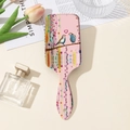 Detailed back view of a bird and floral print air cushion hairbrush with hanging hole - Watercolor Bird Pink Style (A)