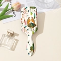 Detailed view of floral hairbrush with bird prints against an elegant lifestyle background - Floral Bird Creamy White Style (B)