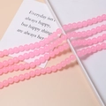 Close-up of translucent pink 8mm jelly beads for DIY jewelry and bracelet making - Single Piece / Pink