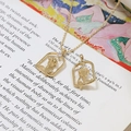 Macro view of gold-plated rose pendants and necklace with zircon inlay on art book - 1# Rose Photo Frame