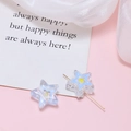 Close-up of star-shaped acrylic beads with yellow center for DIY jewelry making - Blue Pentagram
