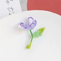 Detailed close-up of handmade beaded flower pendant with purple petals and green leaves - Purple Single Flower
