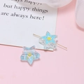 Macro detail of star-shaped resin beads with yellow inner core for DIY jewelry making - Mint Green Star