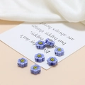 Macro detail of lilac ceramic flower beads with smiling face for DIY jewelry making - Dark Blue Smiley Small Flower