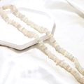 Detailed macro view of natural milky white crystal chip beads with pearlescent luster - 1 Piece / White