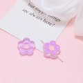 Detailed view of two purple acrylic flower beads with pre-drilled holes for DIY jewelry - Purple Flower