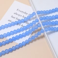 Close-up of sky blue 8mm macaron glass beads for DIY jewelry making and crafts - Single Piece / Blue