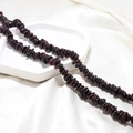 Close-up of deep red natural garnet irregular stone beads for DIY jewelry making - 1 Piece / Dark Brown