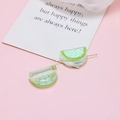 Close-up of watermelon-shaped acrylic beads with gold needle for DIY jewelry making - Light Green Watermelon