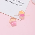 Macro shot of cupcake resin beads with horizontal holes for DIY jewelry making - Pink Orange Cupcake