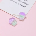 Macro detail of acrylic cupcake beads with needles for DIY jewelry making and crafting - Purple Cupcake