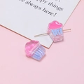 Macro view of pink and blue acrylic cupcake beads for DIY jewelry with metal pin detail - Pink Blue Cupcake