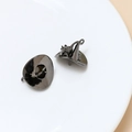 Detailed view of gun-black metal witch hat pendants with smooth polished finish - Gun Black (3# Gun Black)
